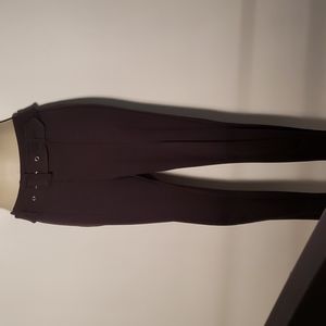 Nine West skinny pants with a belt in a size S.  Excellent condition .